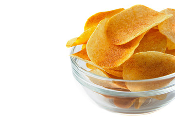 Bowl of tasty crispy potato chips on white background. Fast food snack.