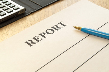 We are preparing a report - a form to fill in on a rustic table.