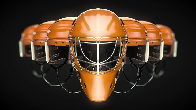 Excellent orange helmets of a hockey team. A camera moves smoothly forward to the hockey helmets(4K,ultra high definition 2160p)