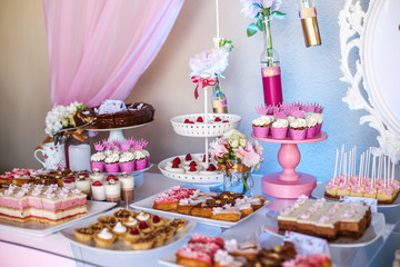 Candy bar with delicious mini cakes, selective focus