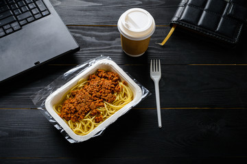 office lunch, frozen spaghetti bolognese on the table