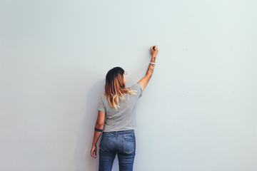 Artist making a sketch on a wall