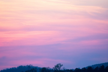 sky and clouds over hills at sunset