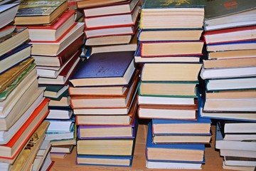 Stack of books on a wooden background.Education.