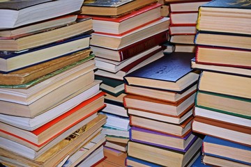 Stack of books on a wooden background.Education.