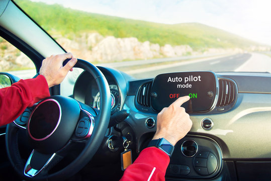 driver turning on auto pilot mode