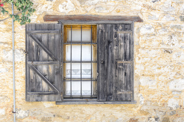 Fototapeta na wymiar Window of a wooden hut