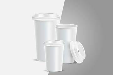 3 White coffee cups mockup on grey background. Cups of different size. Mock up. Mock-up. Coffee away. Coffee to go.