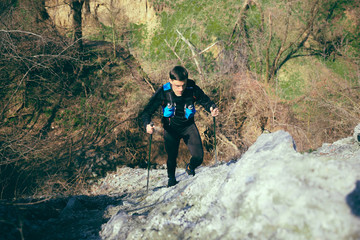 Hiker - man hiking in forest.