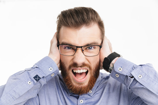 Close up image of Screaming bearded elegant man in eyeglasses