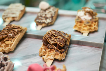 Delicious waffles ready to eat in a shop window