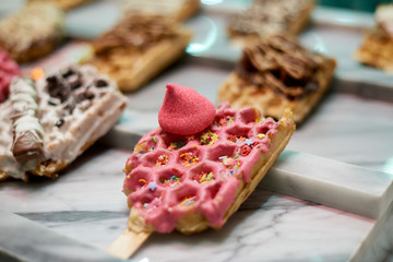 Delicious waffles ready to eat in a shop window