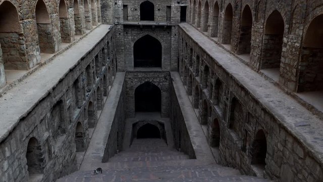 a multi axis gimbal steadicam clip walking down agrasen ki baoli step well in delhi, india