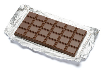 milk chocolate bar covered with foil isolated on white background with clipping path