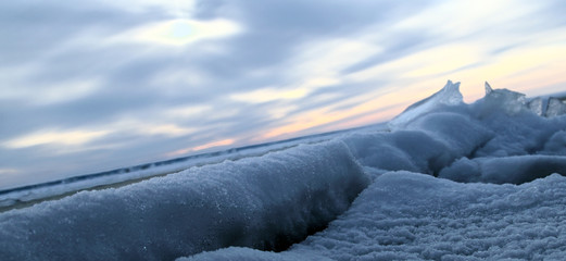 Obraz premium Frozen sea. Snow landscape. Sunset