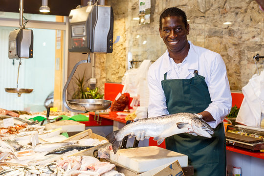 Salesman offering fresh fish