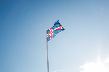 Icelandic flag tearing in the wind against the sky