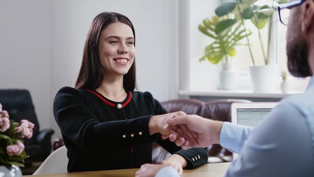Beautiful brunette woman attending job interview