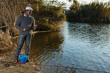 Man fishing with rods