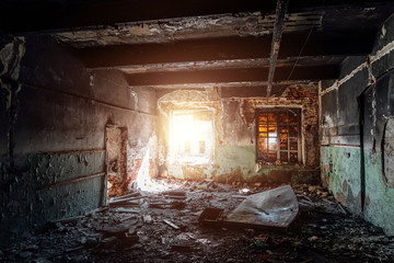 Burned interiors and furniture in industrial or office building. Fire consequences concept 
