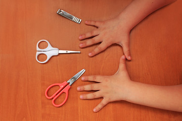 Hand and nail care for the child. Children's manicure. View from above.