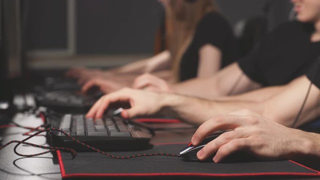 Team of eSport diverse gamers playing video games on a cyber game contest