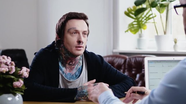 Alternative man attending job interview
