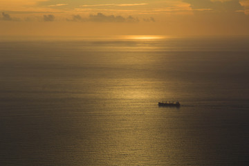 Naklejka na ściany i meble sunset with ship at the sea