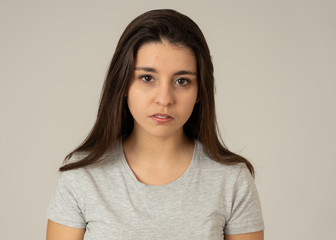 Portrait of beautiful young woman with angry and serious face. Human expressions and emotions