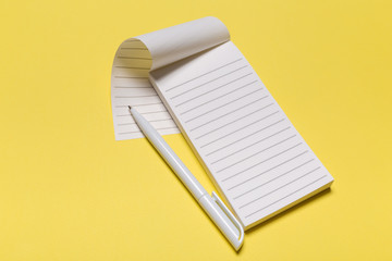 school notebook on a yellow background