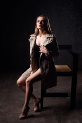 Fototapeta premium fashion portrait of young sexy wet woman siting on the chair