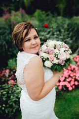Portrait of a beautiful bride with a bouquet