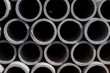 The gray water pipe is lying on each other in rows, building materials