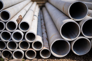 Fototapeta premium The gray water pipe is lying on each other in rows, building materials