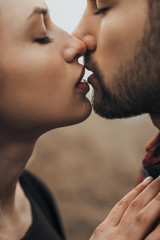 Young romantic couple is kissing and enjoying the company of each other.
