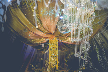 Elegant crystals hanging above wedding reception
