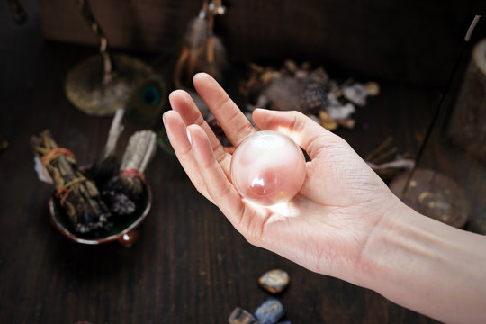 Magic ball. Divination from a glass ball.  The fairy looks to the future.