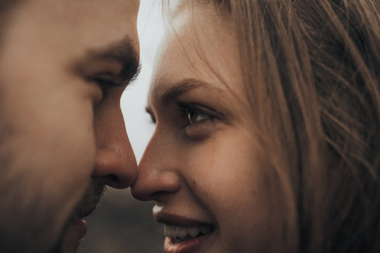 Young romantic couple is kissing and enjoying the company of each other.