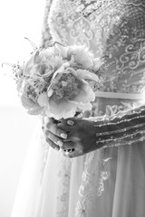 Black and white photo af a bride in wedding dress