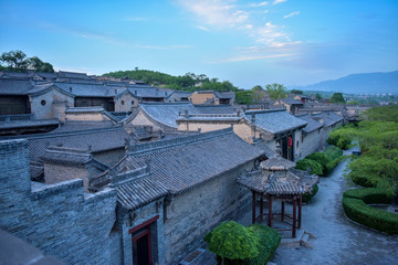 Fototapeta na wymiar Overlooking Chinese ancient buildings, tile roof of houses