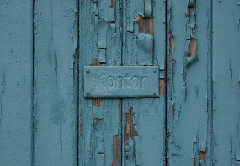 The old inscription on an ancient, vintage door