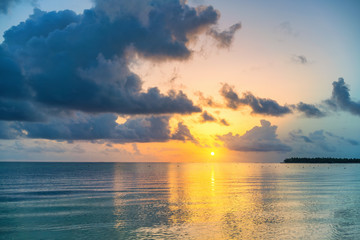 Fototapeta premium Beautiful cloudy sunrise over ocean in Dominican Republic