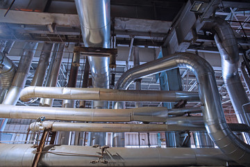 Equipment, cables and piping as found inside of a modern industrial power plant