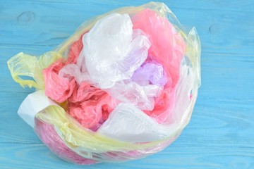 Collection of plastic bags for recycling. Polyethylene bag with selective focus. A pile of plastic bags after shopping.  Ecological problem. Environmental pollution by plastic garbage 