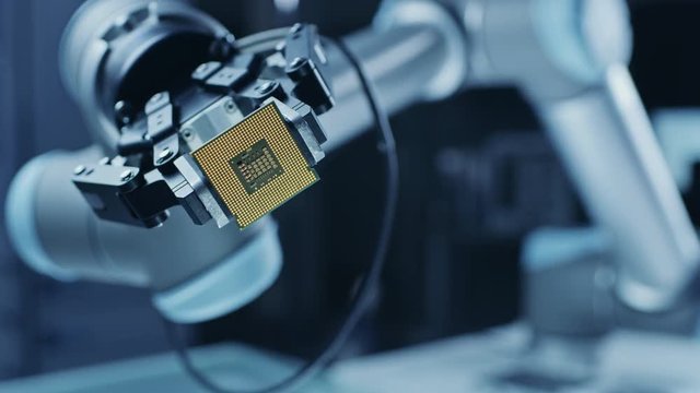 Modern High Tech Robot Arm Moving, Showing Contemporary Super Computer Processor on Camera. Stylish Close-up, Moving into Focus Camera Shot.