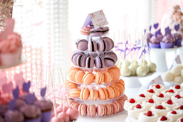 Table full with cakes and sweets at a wedding reception