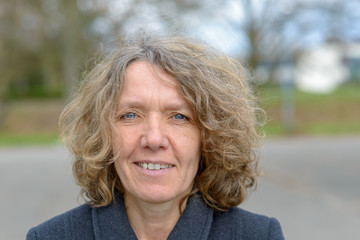 Bust portrait of smiling middle aged woman