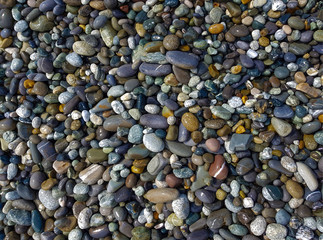 pebbles on the beach, rubble on the seashore, top view