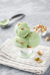 Pistachio ice cream with chopped nuts. Summer dessert.