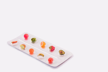 tablet of pills with fruit inside like nature medicine